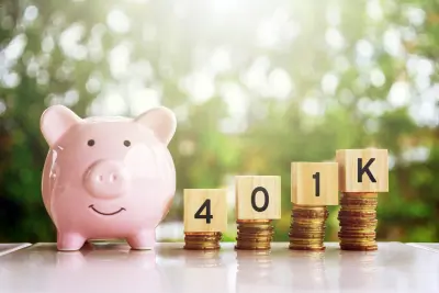 Pink piggy bank and ‘401K’ spelled with wooden blocks on ascending coin stacks, symbolizing the growth of 401(k) benefits.