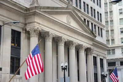 Federal building with American flags, representing Federal Benefits.