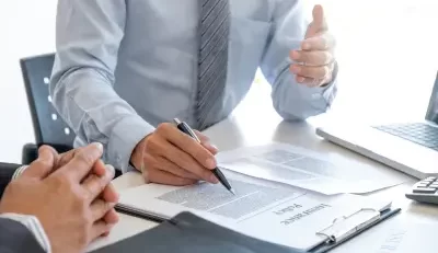 Business discussion on insurance and life insurance policies.