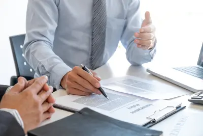 Business discussion on insurance and life insurance policies.