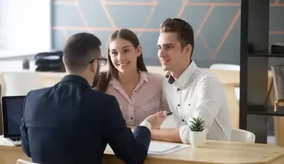 Couple receiving federal employee benefits counseling from The Benefits Coordinator.