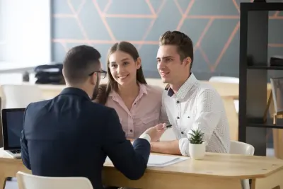 Couple receiving federal employee benefits counseling from The Benefits Coordinator.