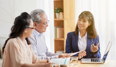 Advisor explaining federal employee retirement benefits to a couple.
