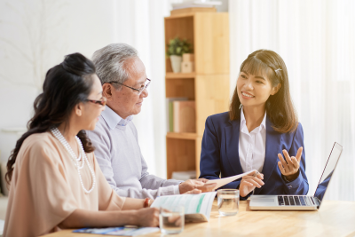 Advisor explaining federal employee retirement benefits to a couple.