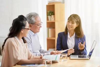 Advisor explaining federal employee retirement benefits to a couple.
