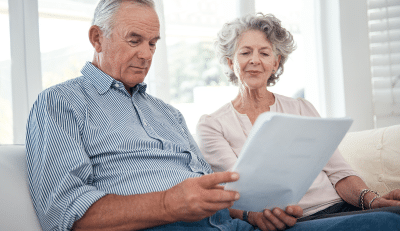 Senior couple reviewing papers about inherited IRA tax
