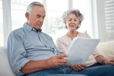 Senior couple reviewing papers about inherited IRA tax