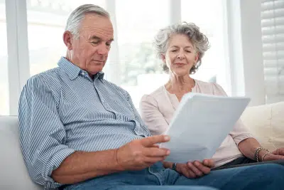 Senior couple reviewing papers about inherited IRA tax