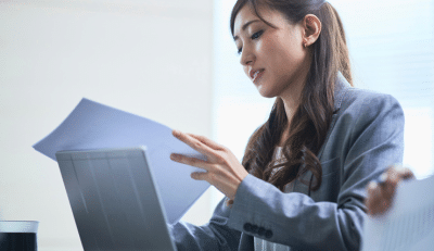 Federal Employee reviewing documents about the advantage of Roth IRA.