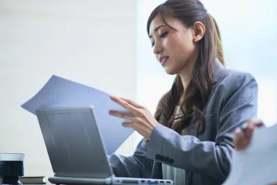 Federal Employee reviewing documents about the advantage of Roth IRA.