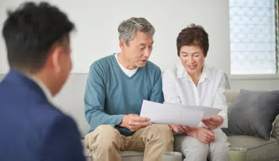 Retired couple reviewing documents about their required RMD.
