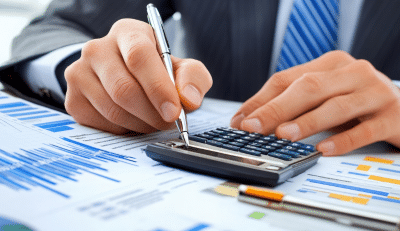 Man using calculator on charts for FERS retirement calculator planning