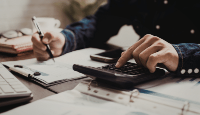 Person calculating numbers for a TSP Roth conversion strategy