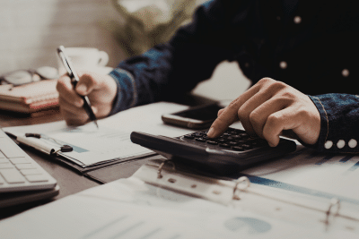 Person calculating numbers for a TSP Roth conversion strategy