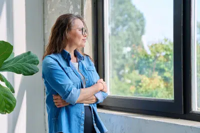 Woman reflecting on federal survivor benefits planning
